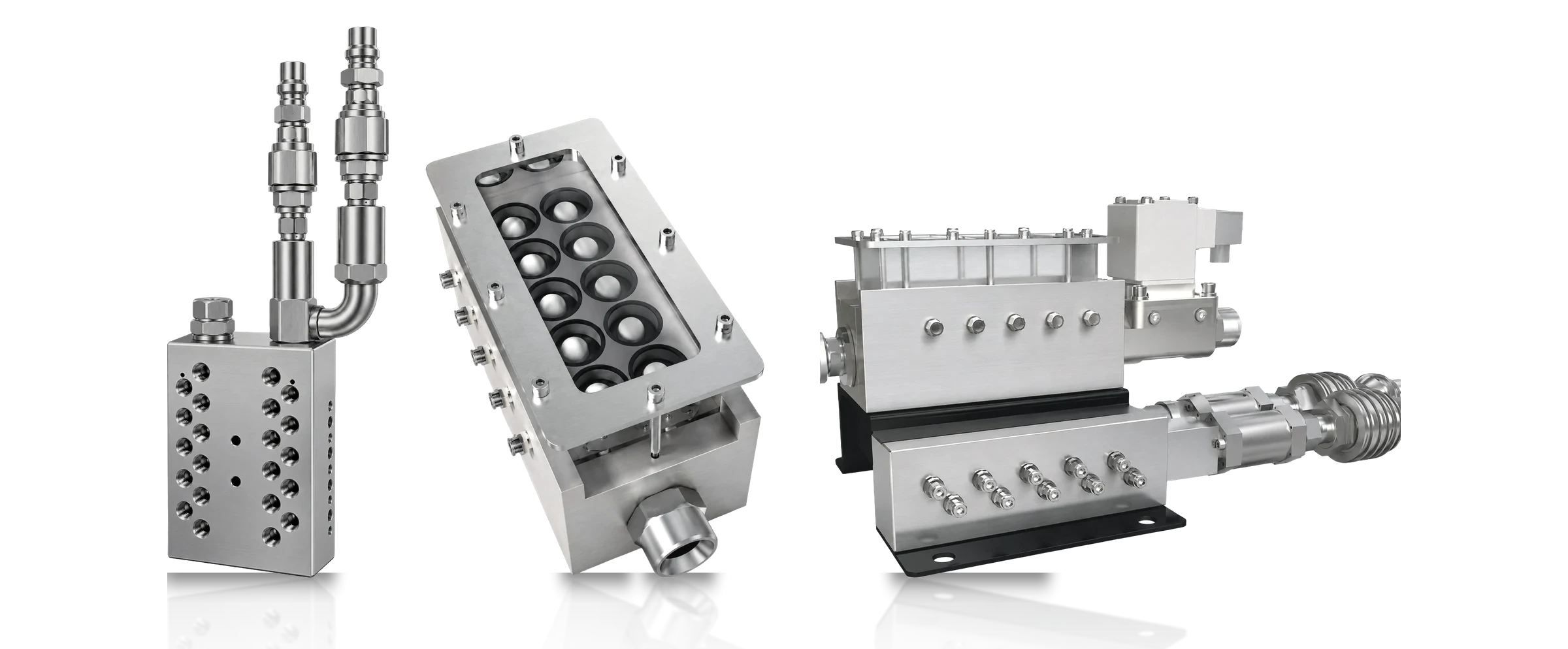 Three Precision System accessories on a studio ground: a stainless manifold block with quick-release couplings, a visual flow manifold with sight bowls, and an injection shot-end assembly.